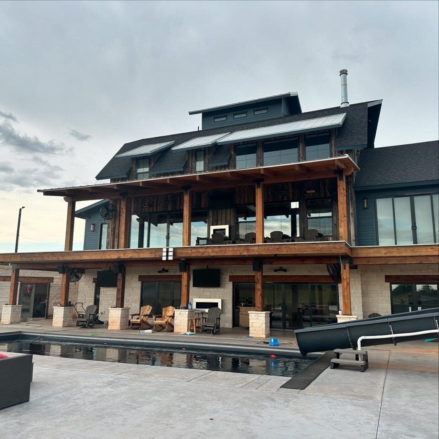 Back of the multilevel Cottonwood Creek home with pool